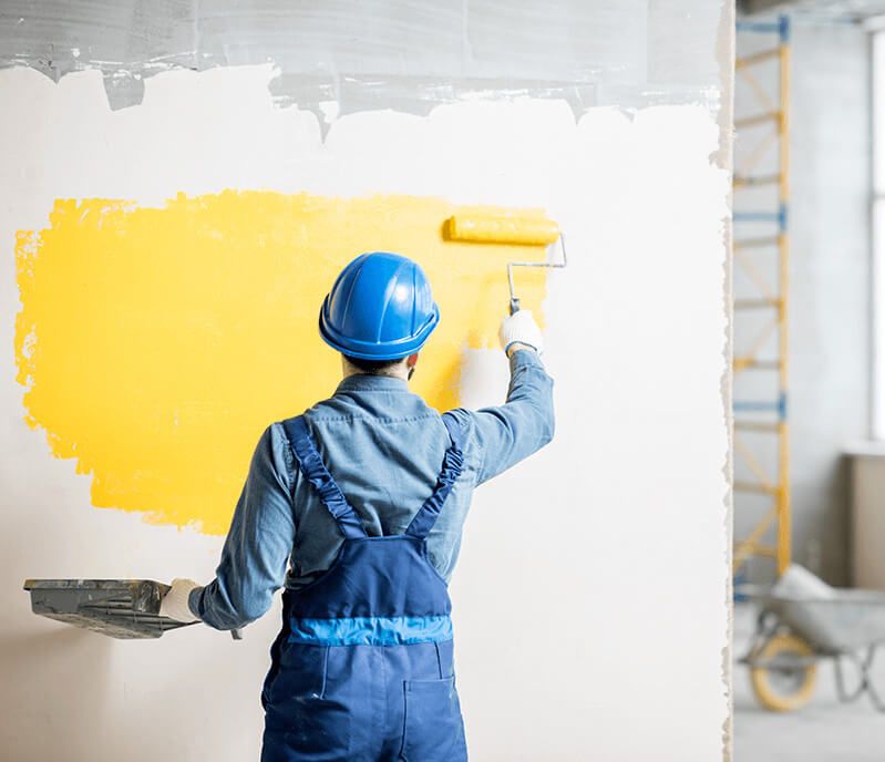 Wall getting a coating of paint. 