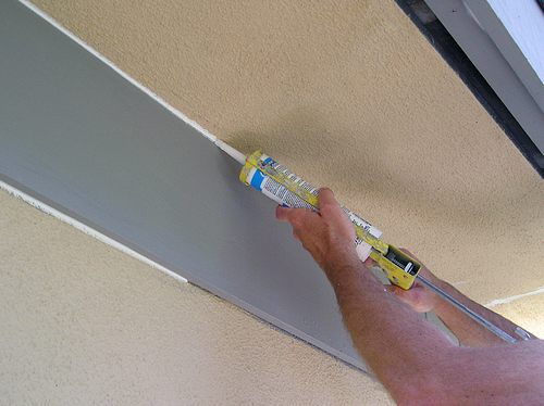 Corners of a wall being fixed. 
