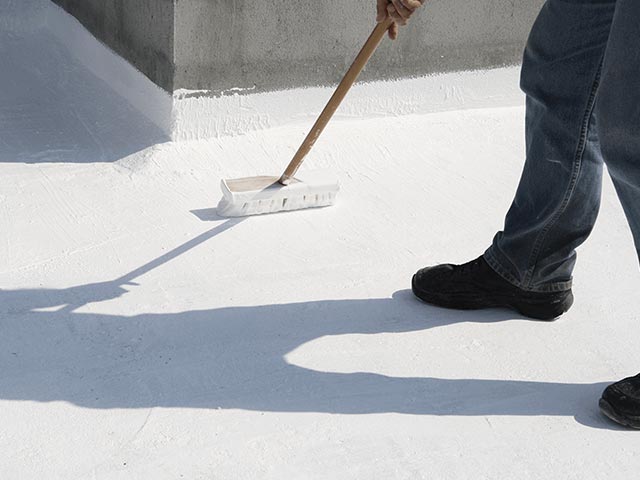 roof coating a commercial building in Tucson.