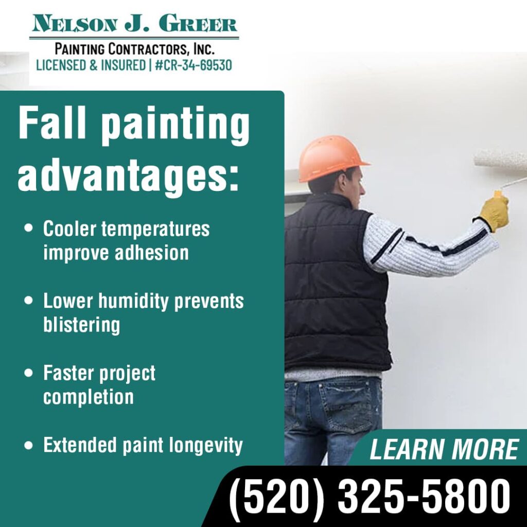 A painter in a hard hat, vest, and jeans uses a roller to paint a white wall. To the left, text lists "Fall painting advantages" including cooler temperatures improving adhesion, lower humidity preventing blistering, faster project completion, and extended paint longevity. The "Nelson J. Greer Painting Contractors, Inc." logo, phone number (520) 325-5800, and "LEARN MORE" are at the bottom.
