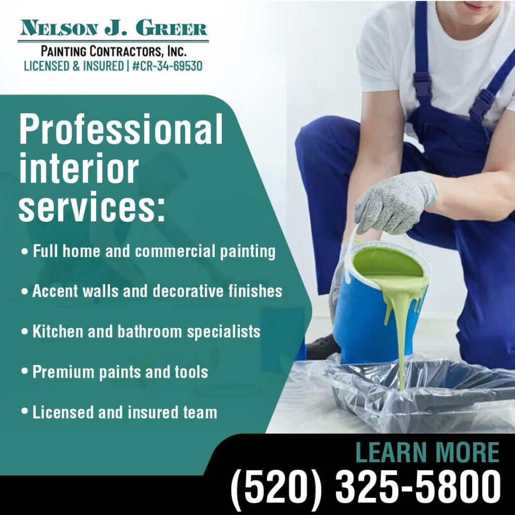 A painter in blue overalls kneels, pouring light green paint from a large blue bucket into a black roller tray. Text on the left promotes "Professional interior services" including full home and commercial painting, accent walls, kitchen and bathroom specialists, premium paints, and a licensed and insured team, all under the "Nelson J. Greer Painting Contractors, Inc." logo. A phone number (520) 325-5800 and "LEARN MORE" are at the bottom.